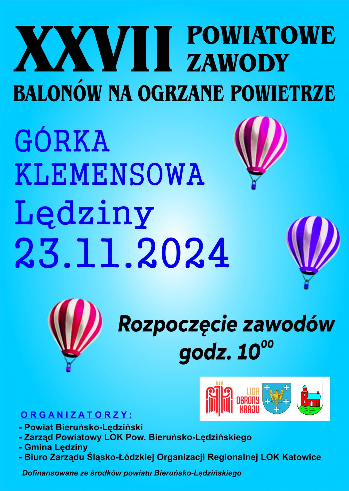 Plakat informacyjny w kolorze niebieskim z trzema balonami, na dole herby powiatu, Miasta Lędziny oraz Ligi Obrony Kraju